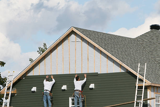Professional Siding Contractor technician working in Slovan, PA